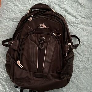 NWOT High Sierra backpack. Four large compartments, one padded for a laptop.